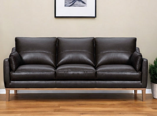 87" Dark Brown Leather Sofa And Toss Pillows With Brown Legs