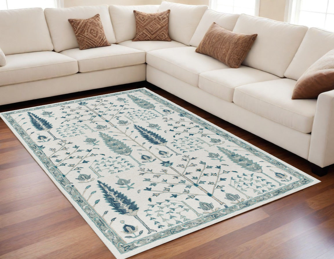 9' X 12' Ivory and Blue Wool Floral Hand Tufted Area Rug