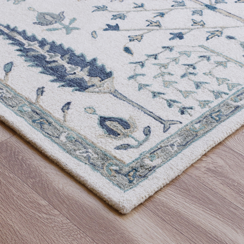 9' X 12' Ivory and Blue Wool Floral Hand Tufted Area Rug