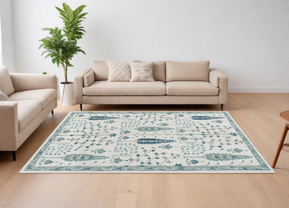 9' X 12' Ivory and Blue Wool Floral Hand Tufted Area Rug