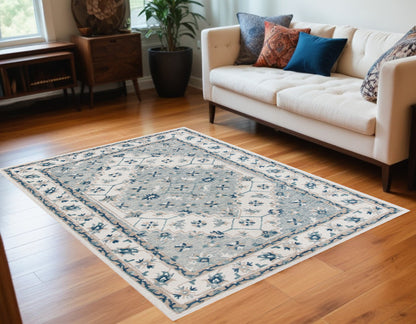 5' X 8' Blue and Ivory Wool Floral Hand Tufted Area Rug