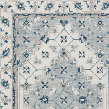 5' X 8' Blue and Ivory Wool Floral Hand Tufted Area Rug