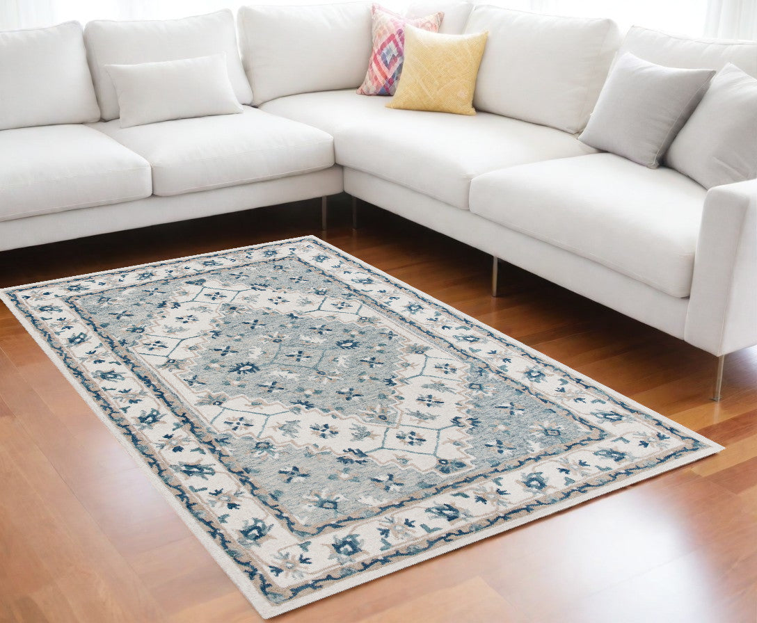 5' X 8' Blue and Ivory Wool Floral Hand Tufted Area Rug