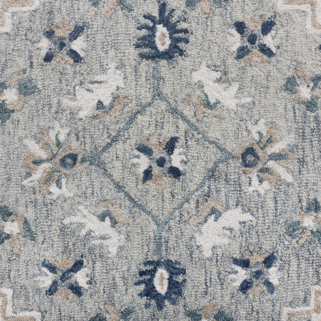 5' X 8' Blue and Ivory Wool Floral Hand Tufted Area Rug