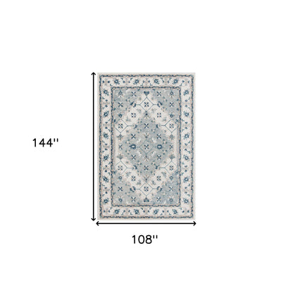 5' X 8' Blue and Ivory Wool Floral Hand Tufted Area Rug