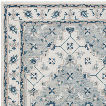 5' X 8' Blue and Ivory Wool Floral Hand Tufted Area Rug