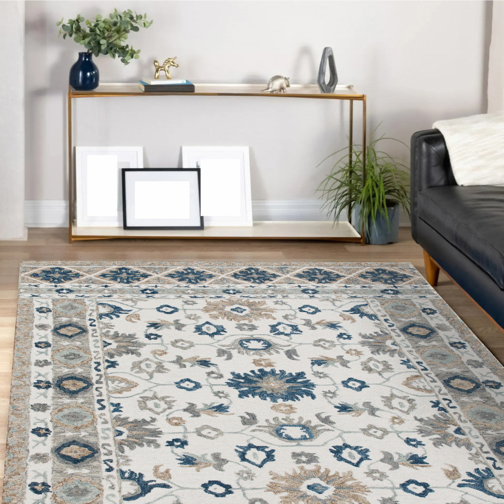 9' X 12' Blue and Ivory Wool Floral Hand Tufted Area Rug