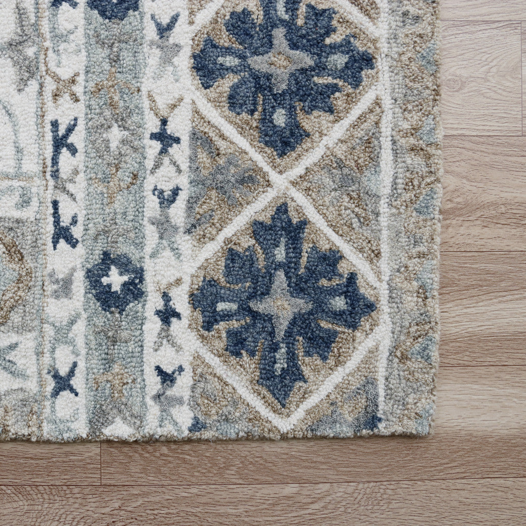 9' X 12' Blue and Ivory Wool Floral Hand Tufted Area Rug