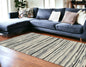 5' X 8' Beige and Gray Abstract Area Rug