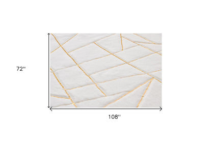 2' X 3' White and Gold Faux Fur Abstract Shag Non Skid Area Rug