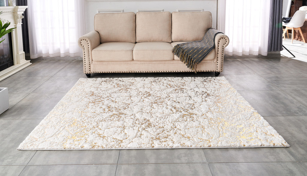 2' X 3' White and Gold Faux Fur Abstract Shag Non Skid Area Rug