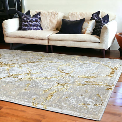 3' X 5' Beige and Gold Abstract Area Rug