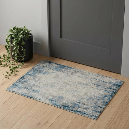 2' X 3' Blue and Ivory Abstract Area Rug