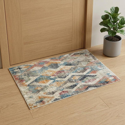 2' X 3' Beige Blue and Gray Geometric Distressed Area Rug With Fringe