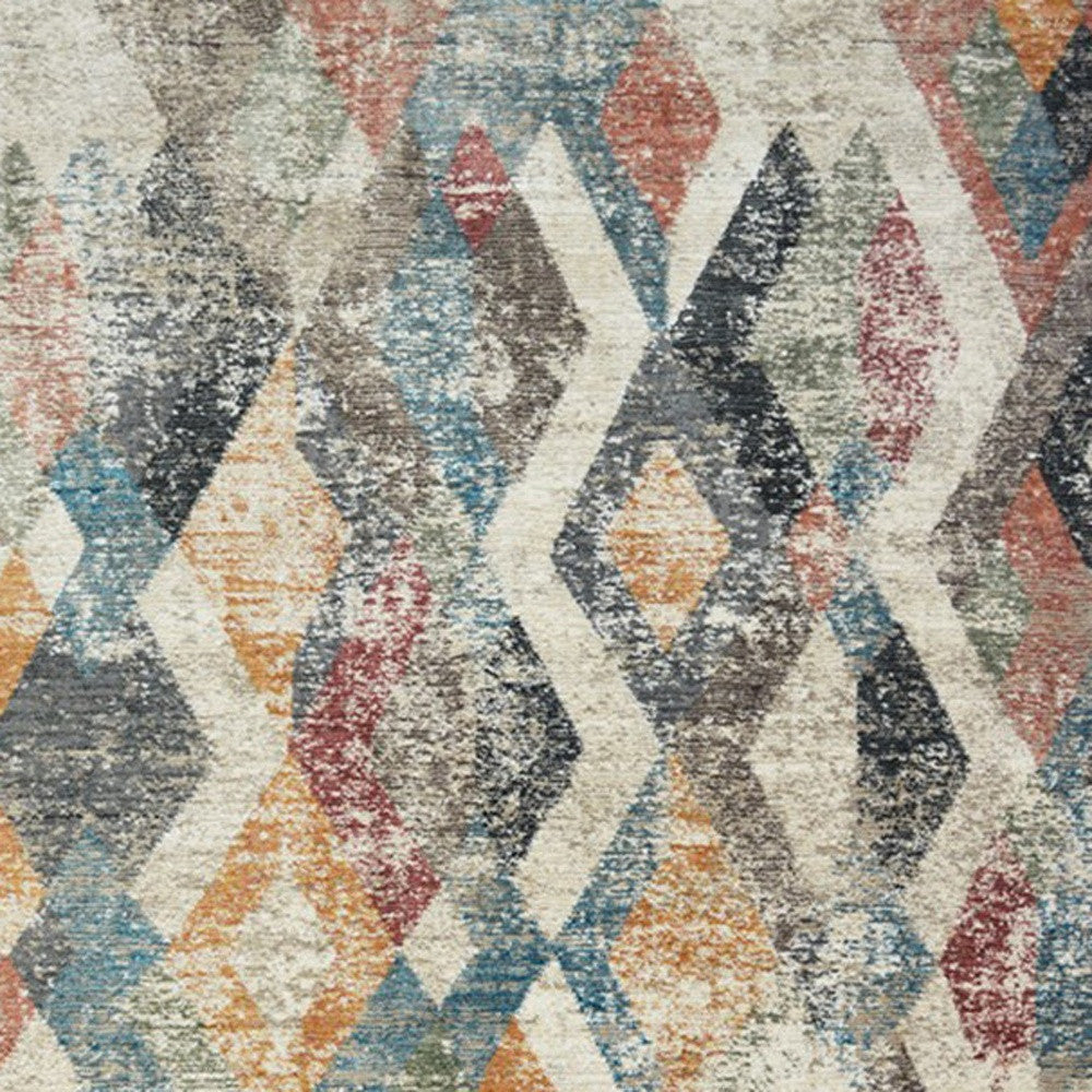 5' X 8' Beige Blue and Gray Geometric Distressed Area Rug With Fringe