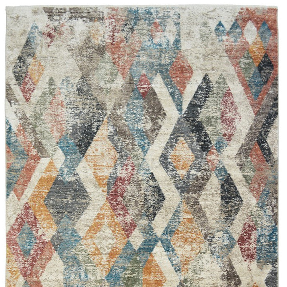 5' X 8' Beige Blue and Gray Geometric Distressed Area Rug With Fringe