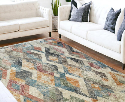 8' X 10' Beige Blue and Gray Geometric Distressed Area Rug With Fringe