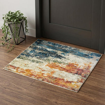 2' X 3' Beige Blue and Ivory Abstract Distressed Area Rug With Fringe