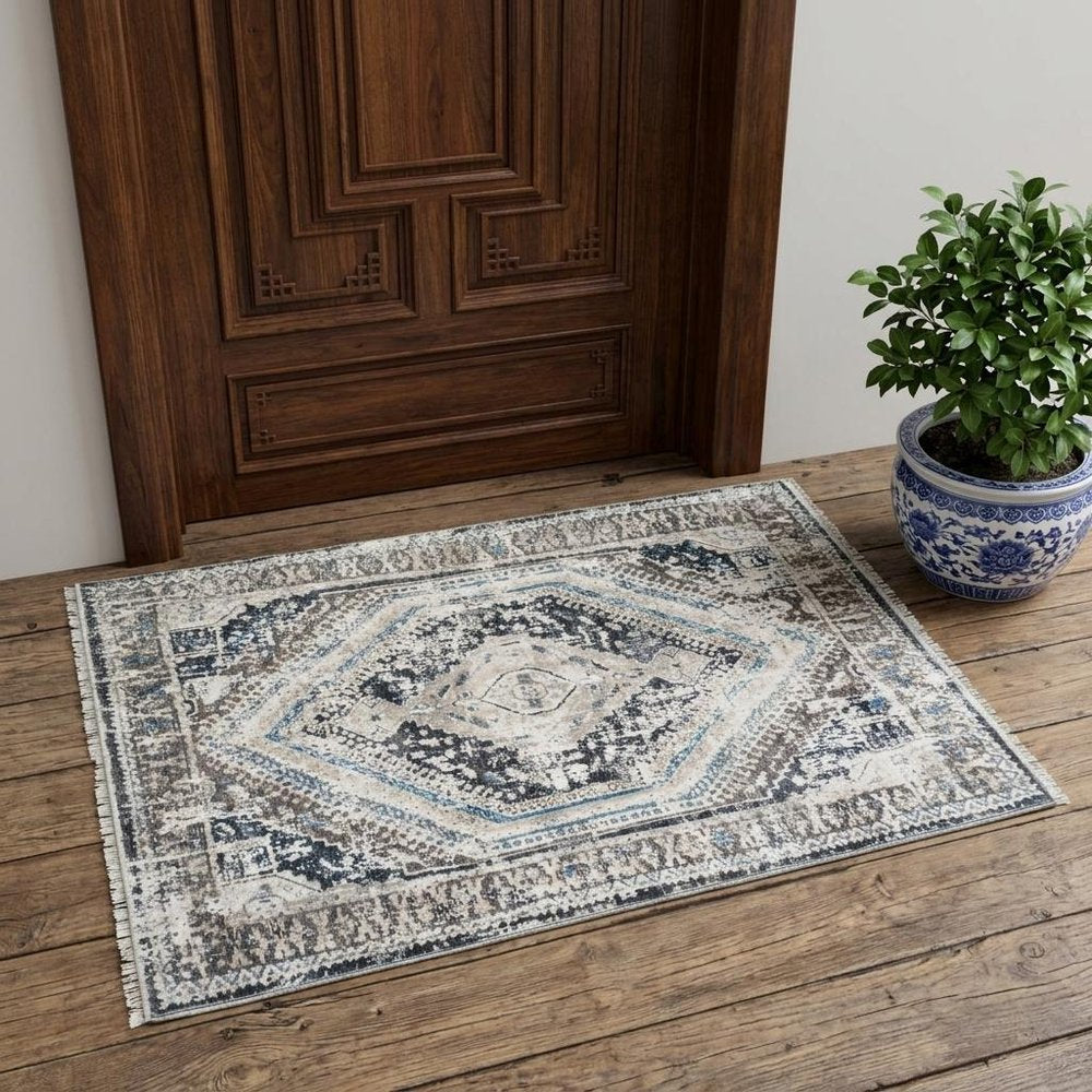 2' X 3' Gray Beige and Blue Geometric Distressed Area Rug With Fringe