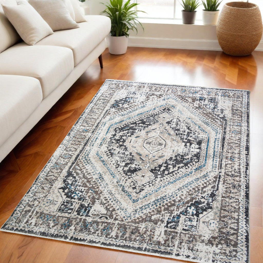 5' X 8' Gray Beige and Blue Geometric Distressed Area Rug With Fringe