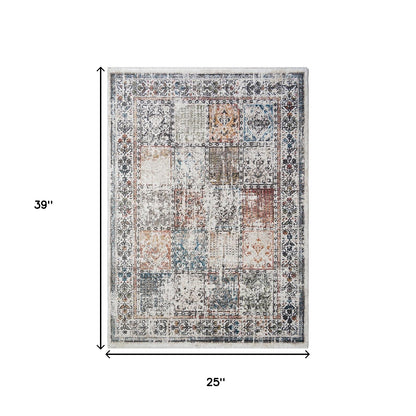 2' X 3' Ivory Blue and Gray Patchwork Distressed Area Rug With Fringe