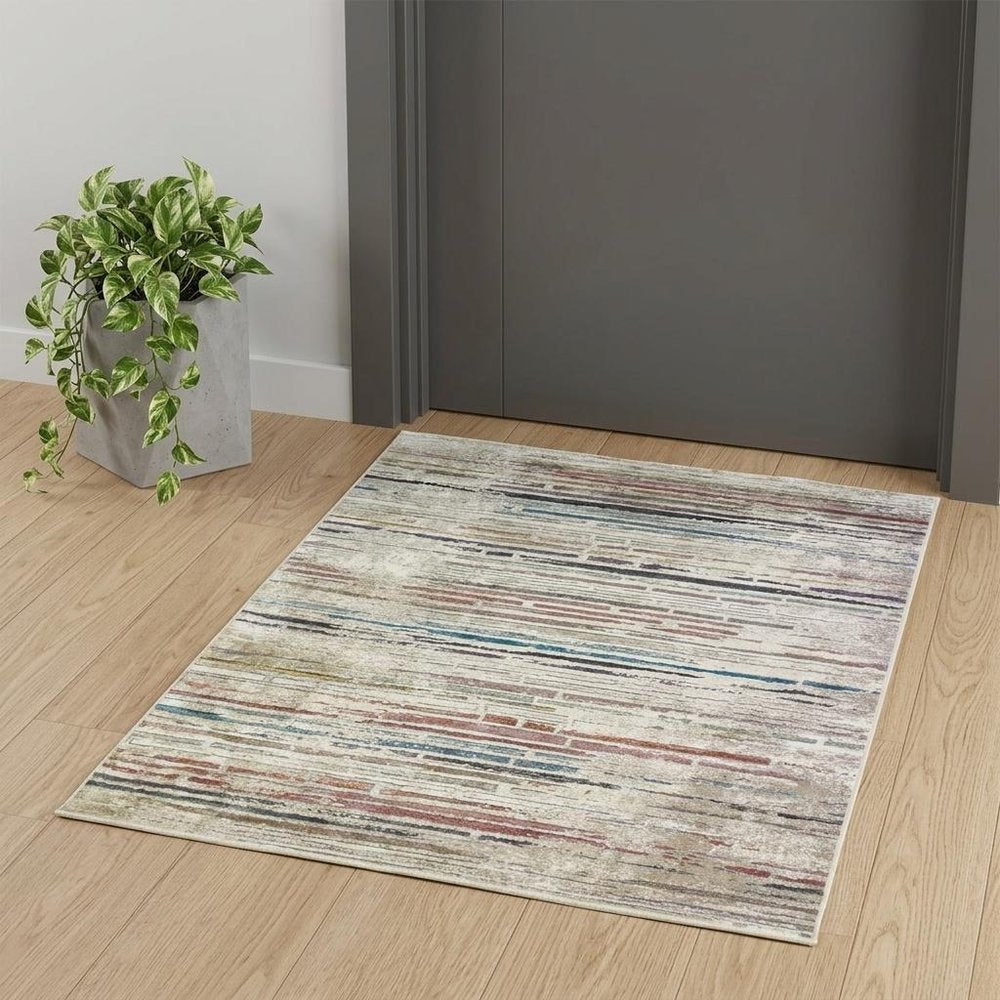 2' X 3' Beige Geometric Distressed Area Rug With Fringe