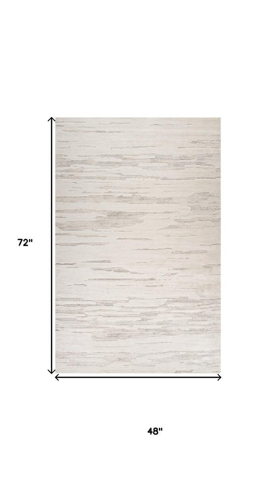 4' X 6' Gray and Beige Geometric Distressed Area Rug