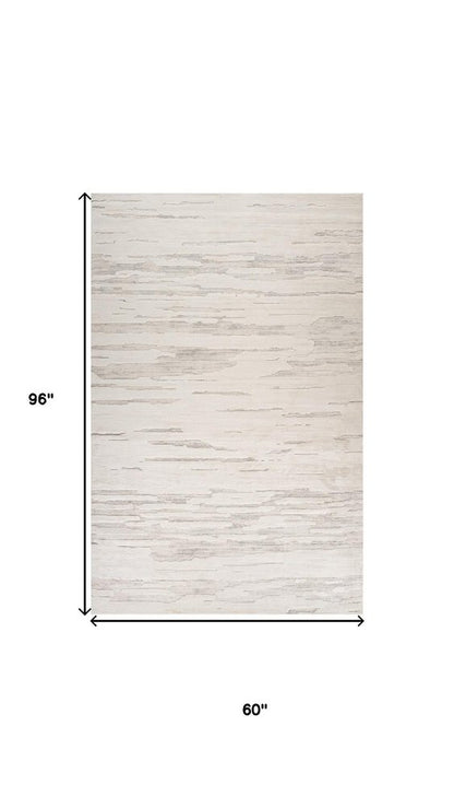 5' X 8' Gray and Beige Abstract Distressed Area Rug