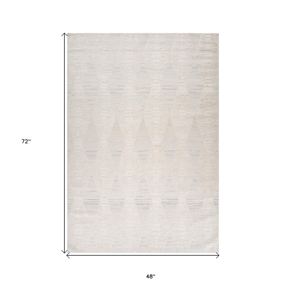 4' X 6' Cream and Beige Geometric Distressed Area Rug
