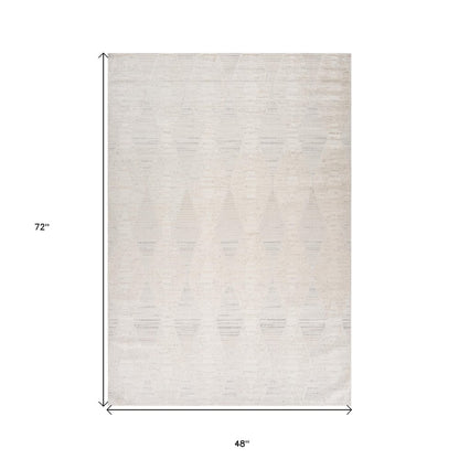 4' X 6' Cream and Beige Geometric Distressed Area Rug