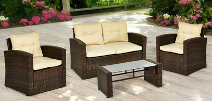 Four Piece Outdoor Brown Wicker Sofa Seating Group with Beige Cushions