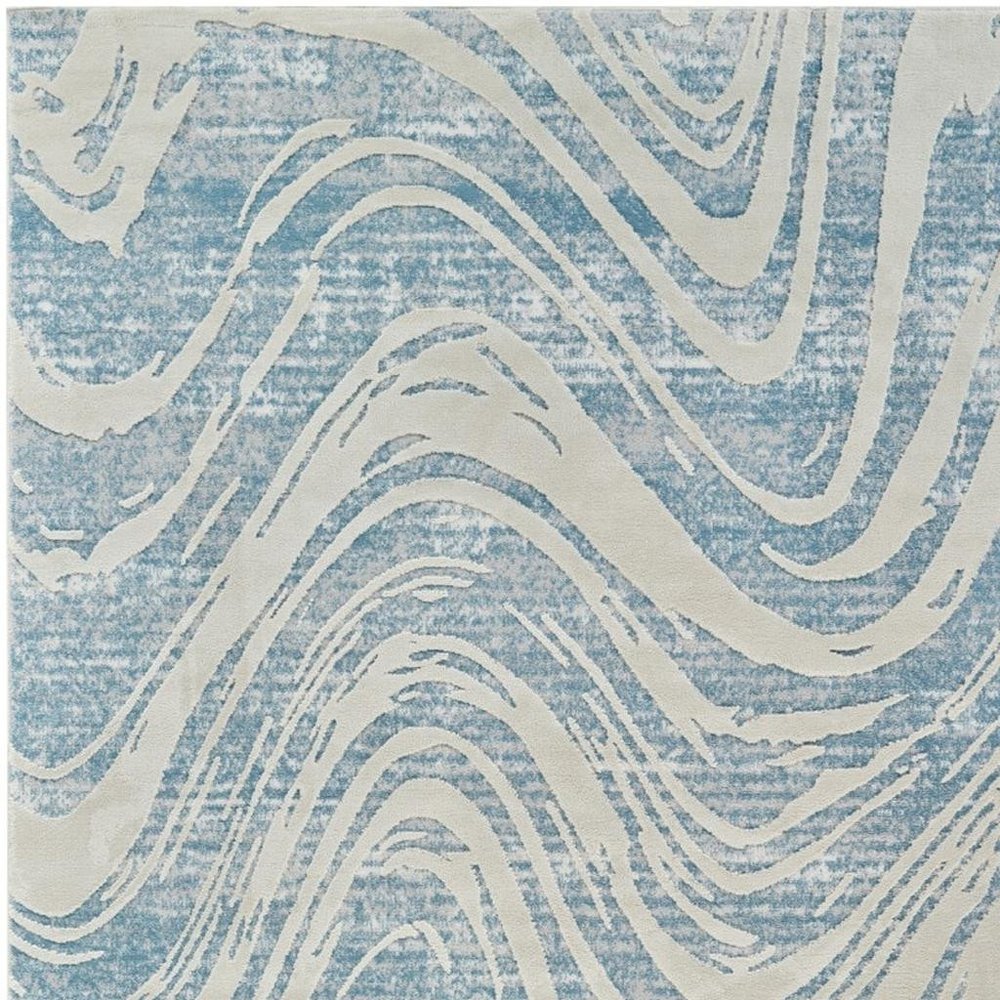 5' X 8' Blue and Beige Abstract Distressed Area Rug