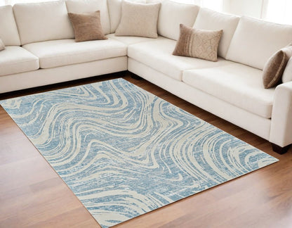 5' X 8' Blue and Beige Abstract Distressed Area Rug