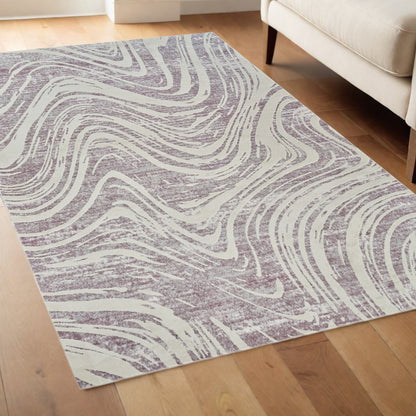 4' X 6' Beige and Purple Abstract Distressed Area Rug