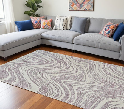 7' X 10' Beige and Purple Abstract Distressed Area Rug