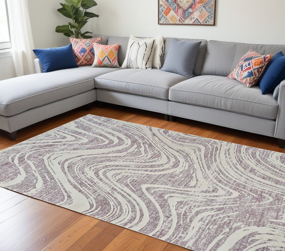 8' X 11' Beige and Purple Abstract Distressed Area Rug