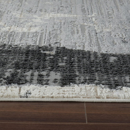 4' X 6' Beige and Black Abstract Distressed Area Rug