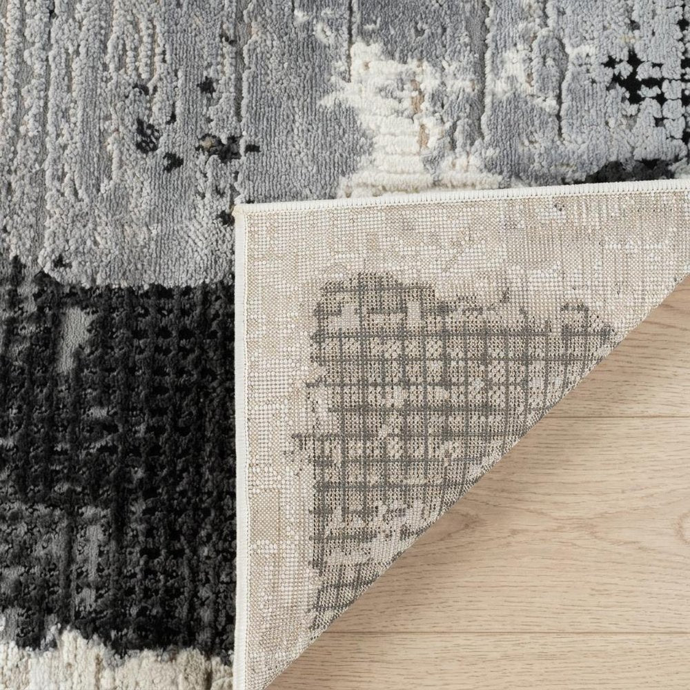 4' X 6' Beige and Black Abstract Distressed Area Rug