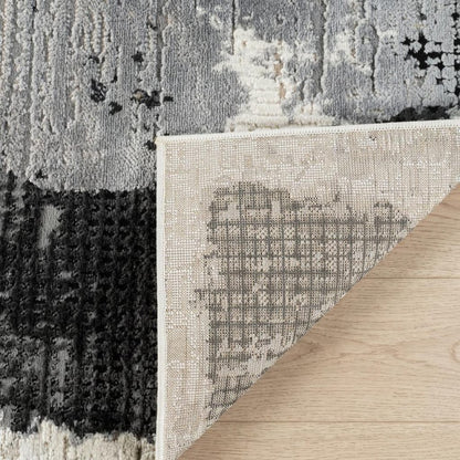 4' X 6' Beige and Black Abstract Distressed Area Rug