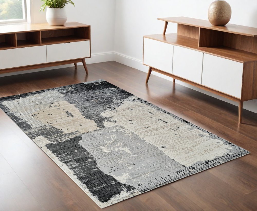 4' X 6' Beige and Black Abstract Distressed Area Rug