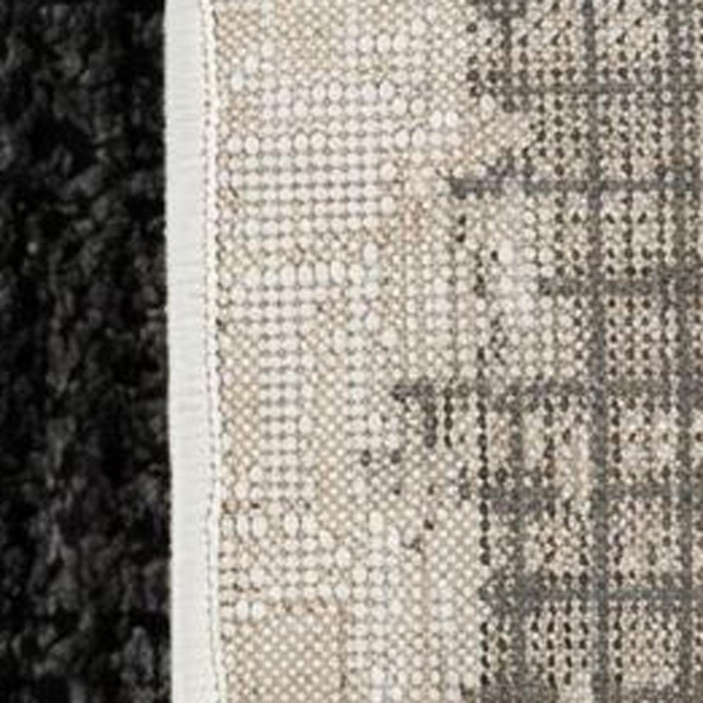 5' X 8' Beige and Black Abstract Distressed Area Rug