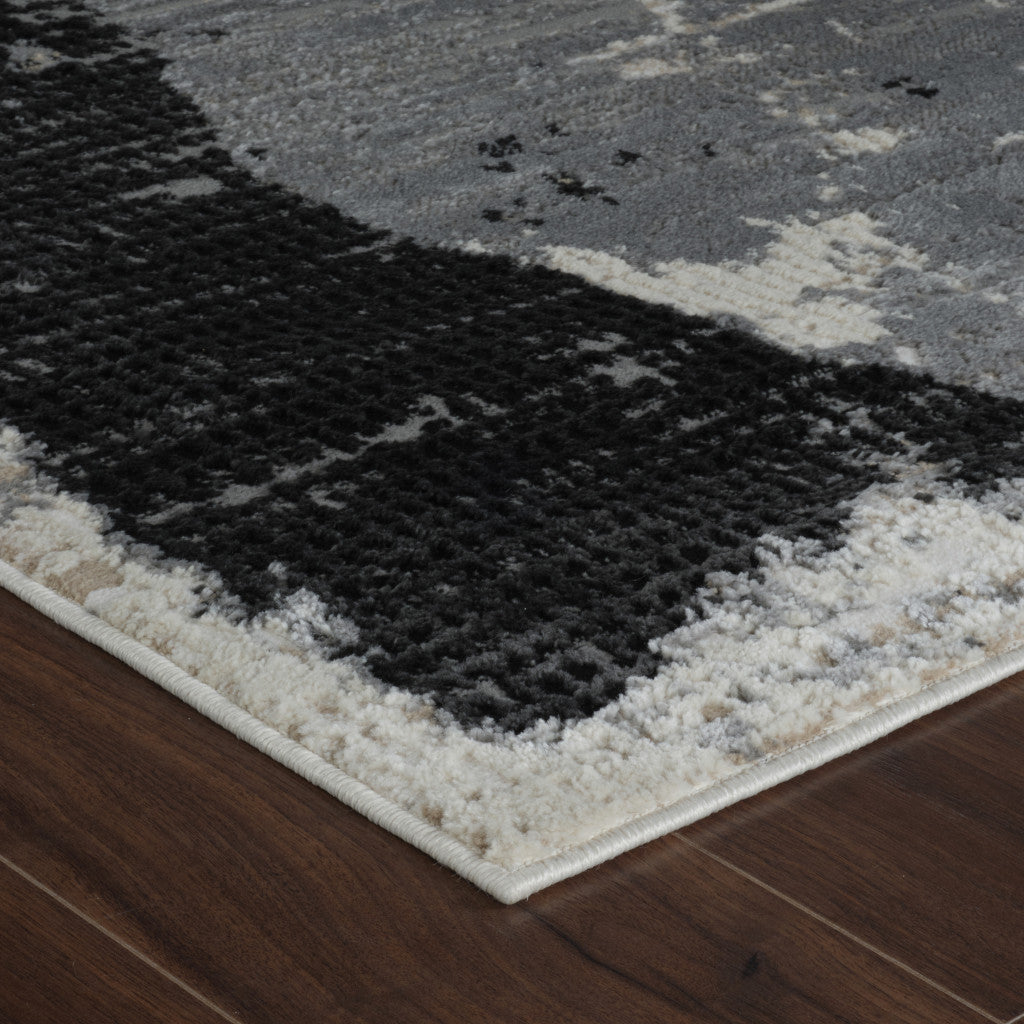 5' X 8' Beige and Black Abstract Distressed Area Rug