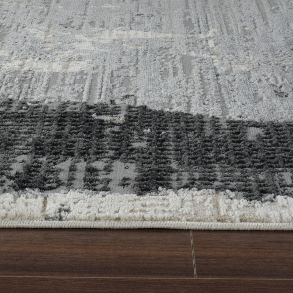 5' X 8' Beige and Black Abstract Distressed Area Rug