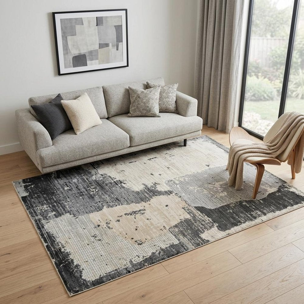 5' X 8' Beige and Black Abstract Distressed Area Rug