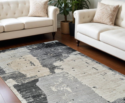 7' X 10' Beige and Black Abstract Distressed Area Rug