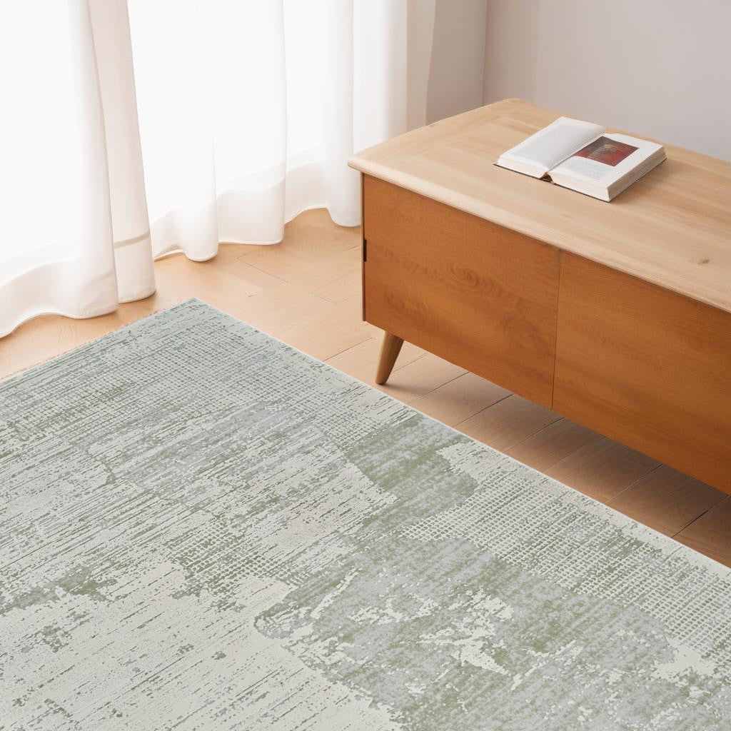 4' X 6' Beige and Green Abstract Distressed Area Rug