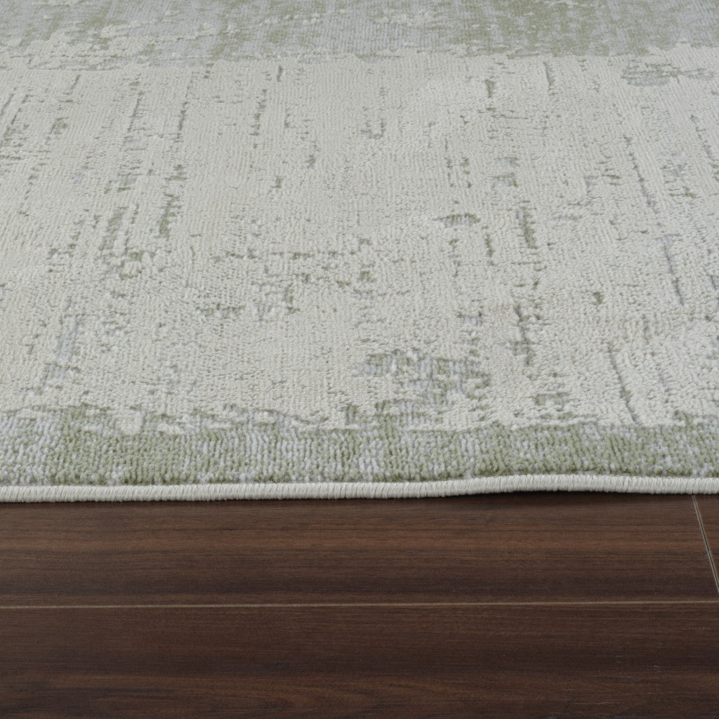 5' X 8' Beige and Green Abstract Distressed Area Rug