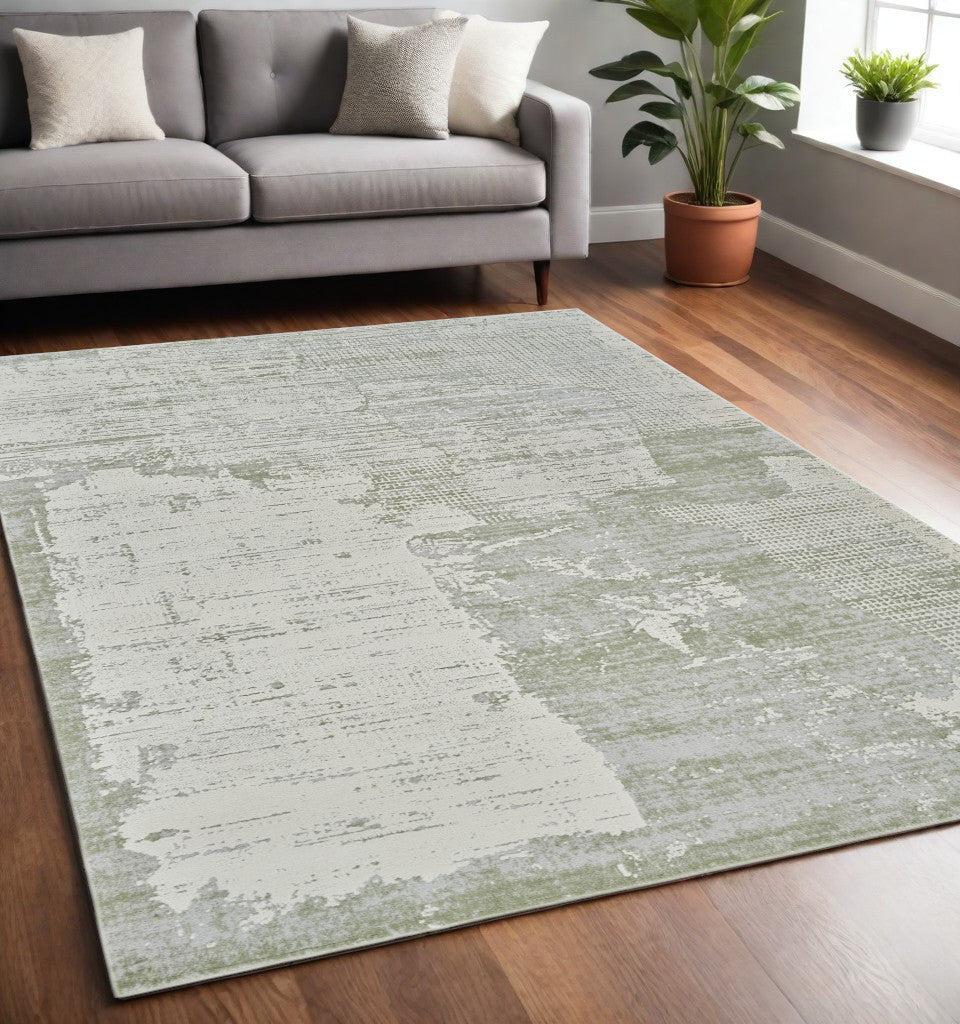 5' X 8' Beige and Green Abstract Distressed Area Rug