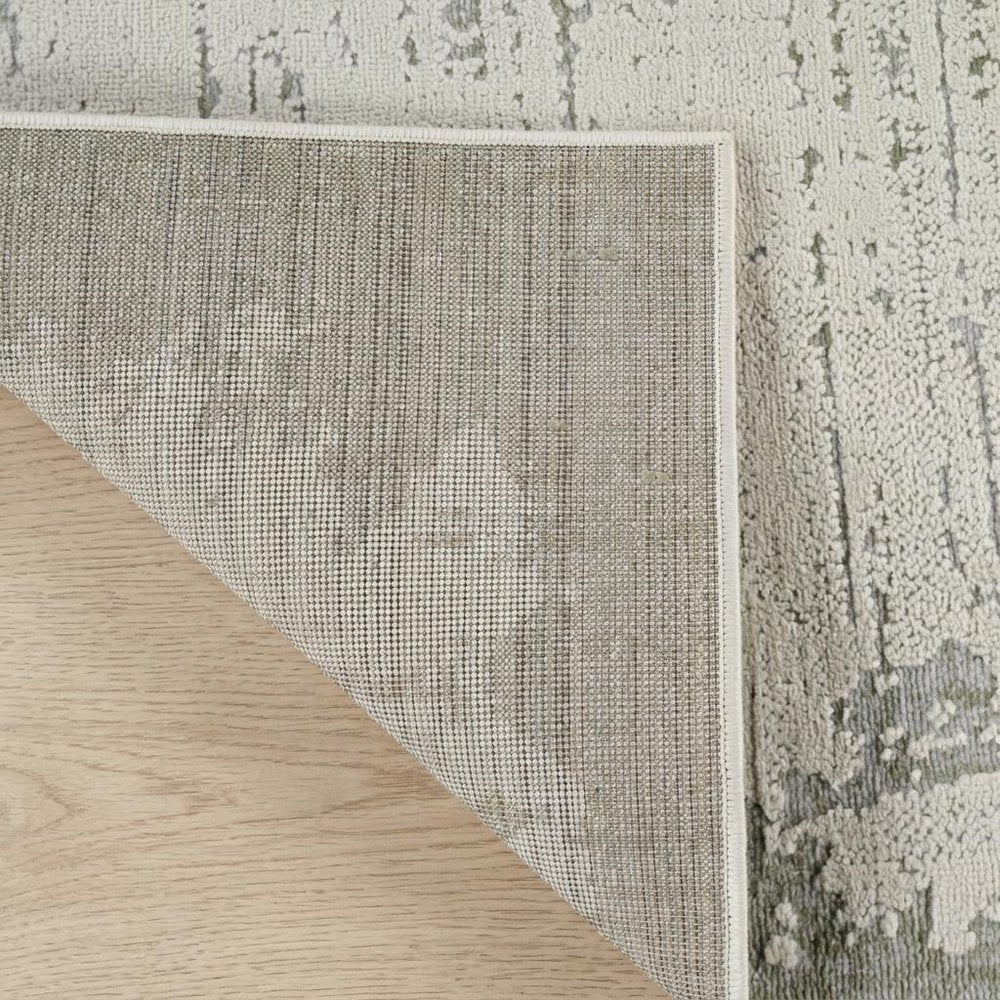 7' X 10' Beige and Green Abstract Distressed Area Rug