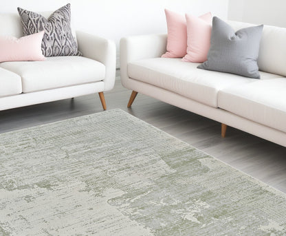 7' X 10' Beige and Green Abstract Distressed Area Rug